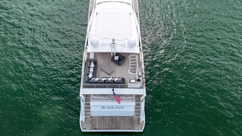Slide: The Image of Aerial view of 2017 Azimut 95 Raised Pilothouse yacht on green water. - 22