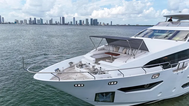 Slide: The Image of Luxurious 2017 Azimut 95 Raised Pilothouse yacht cruising near city skyline. - 25