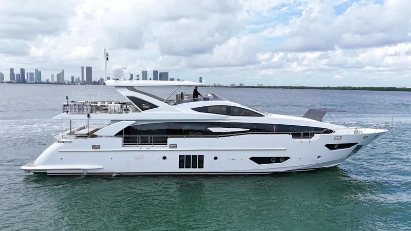 Slide: The Image of Luxury 2017 Azimut 95 Raised Pilothouse yacht cruising on open water. - 3