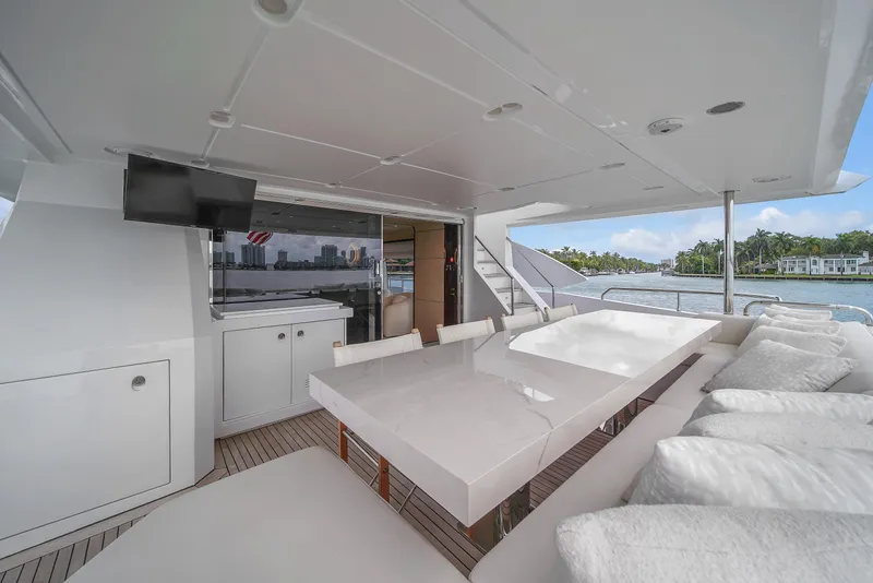 Slide: The Image of Luxurious 2017 Azimut 95 Raised Pilothouse yacht deck with elegant seating and dining area. - 34