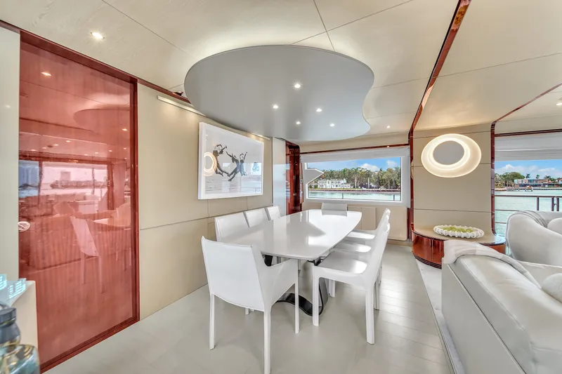 Slide: The Image of Luxurious interior of 2017 Azimut 95 Raised Pilothouse yacht with modern dining area. - 46