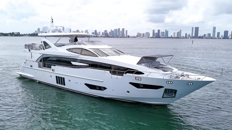 Slide: The Image of Luxurious 2017 Azimut 95 Raised Pilothouse yacht cruising near city skyline. - 5