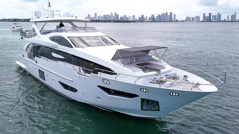 Slide: The Image of Luxurious 2017 Azimut 95 Raised Pilothouse yacht cruising near city skyline. - 6