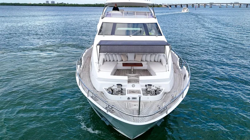 Slide: The Image of Luxury 2017 Azimut 95 Raised Pilothouse yacht cruising on open water. - 8