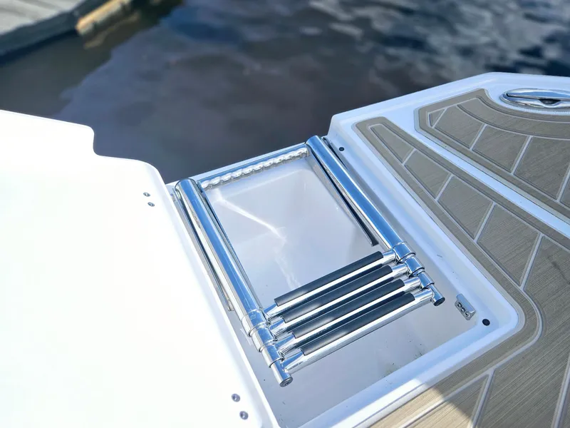 Slide: The Image of Stainless steel boat ladder on 2025 Monterey M-65, dockside view. - 14