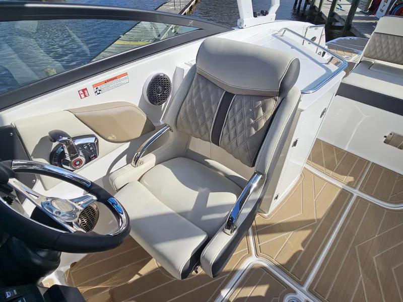 Slide: The Image of Luxurious interior of 2025 Monterey M-65 boat with plush seating and modern steering wheel. - 27