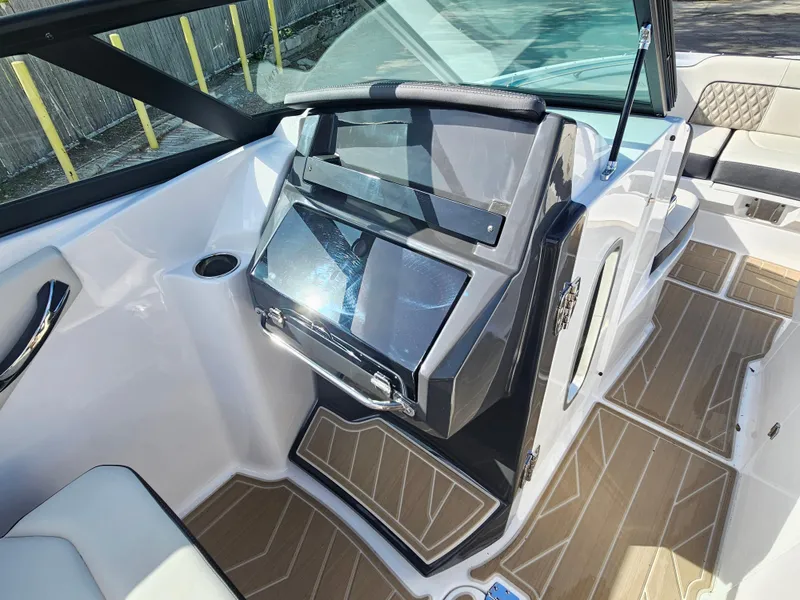 Slide: The Image of 2025 Monterey M-65 boat interior with sleek design and modern dashboard. - 29