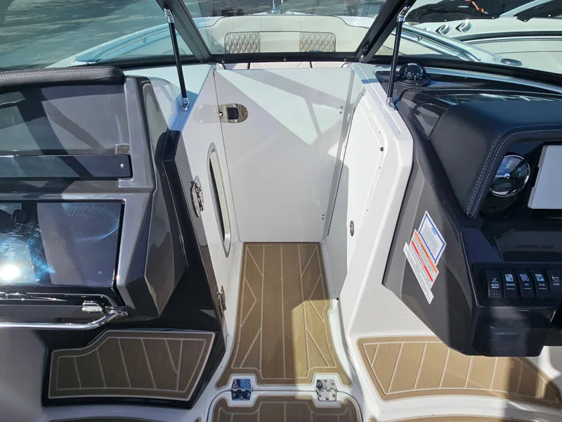 Slide: The Image of Interior view of a 2025 Monterey M-65 boat, featuring sleek design and modern controls. - 30