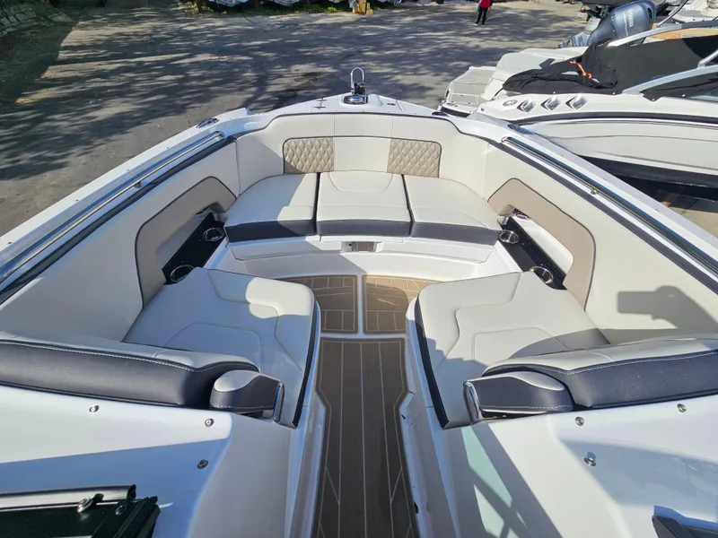 Slide: The Image of 2025 Monterey M-65 boat interior with spacious seating and modern design. - 32