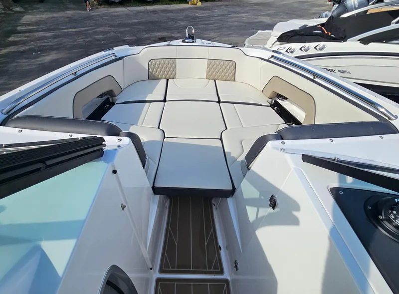 Slide: The Image of 2025 Monterey M-65 boat interior with spacious seating and modern design. - 36