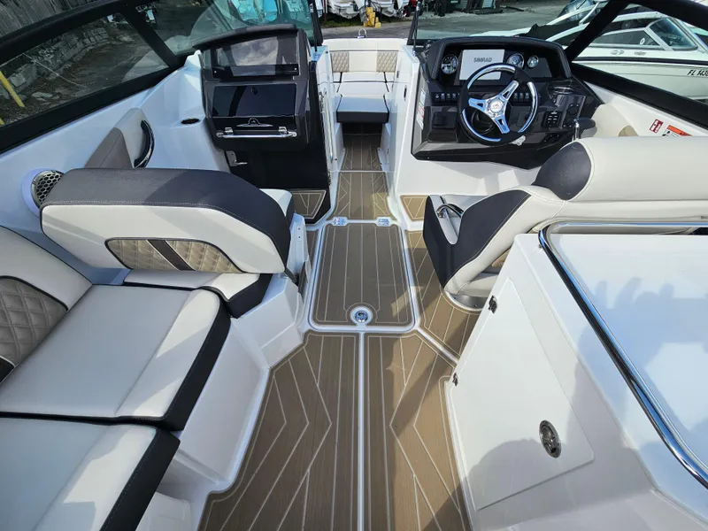 Slide: The Image of 2025 Monterey M-65 boat interior with luxurious seating and modern dashboard design. - 37