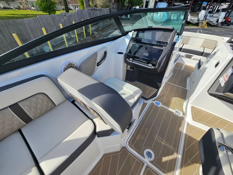 Slide: The Image of 2025 Monterey M-65 boat interior with luxurious seating and modern dashboard design. - 20