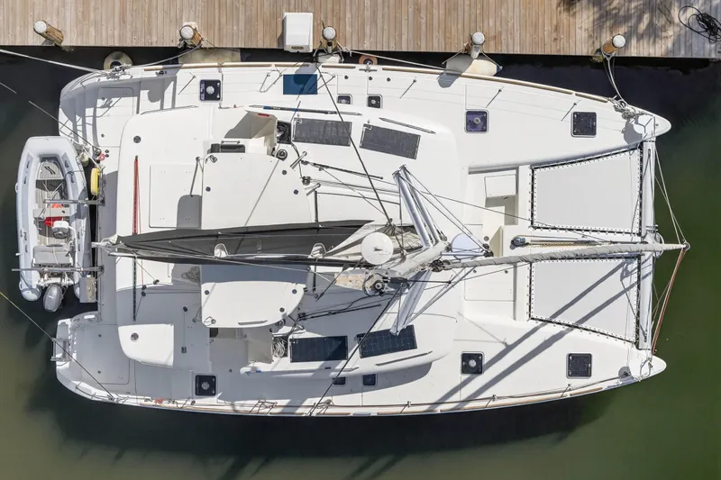 Slide: The Image of Overhead view of a 2019 Lagoon 450 F catamaran docked at a marina. - 13