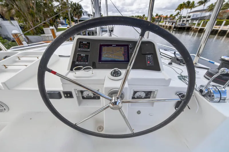 Slide: The Image of Steering wheel and navigation system of 2019 Lagoon 450 F catamaran. - 17