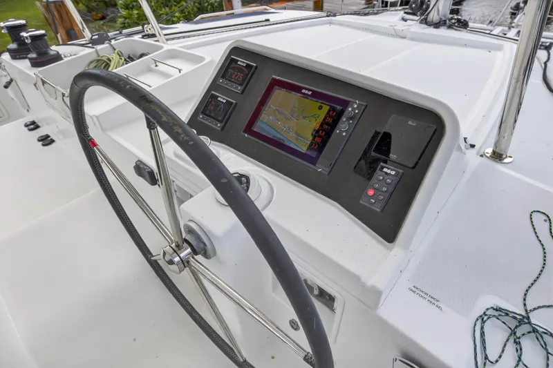 Slide: The Image of Steering wheel and navigation system on 2019 Lagoon 450 F catamaran. - 19