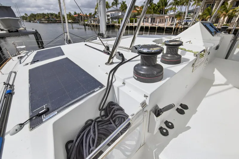 Slide: The Image of 2019 Lagoon 450 F catamaran deck with solar panels and winches. - 21