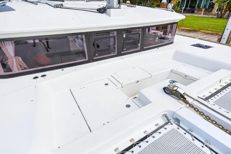 Slide: The Image of 2019 Lagoon 450 F catamaran deck with windows and anchor chain. - 23