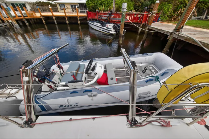 Slide: The Image of Inflatable boat docked beside a 2019 Lagoon 450 F catamaran. - 33