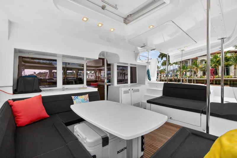 Slide: The Image of Spacious 2019 Lagoon 450 F yacht interior with seating, table, and tropical view. - 39