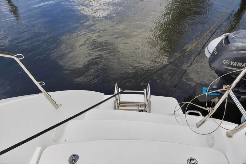 Slide: The Image of Stern view of 2019 Lagoon 450 F catamaran with Yamaha outboard motor. - 47