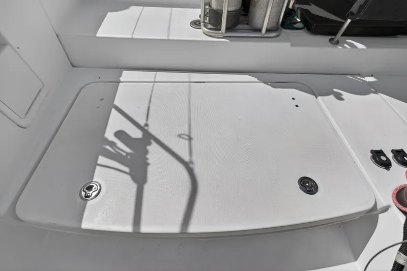 Slide: The Image of Deck area of a 2019 Lagoon 450 F catamaran with storage compartments. - 48