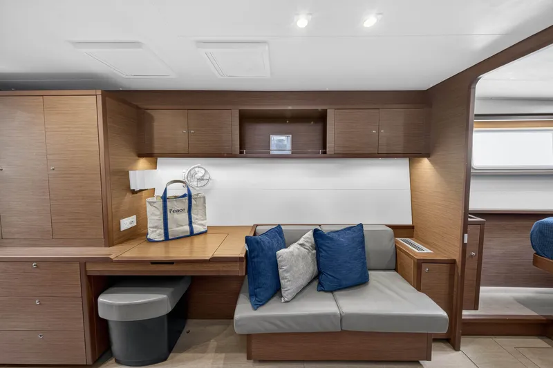 Slide: The Image of Interior of 2019 Lagoon 450 F yacht with modern seating and wooden cabinetry. - 55