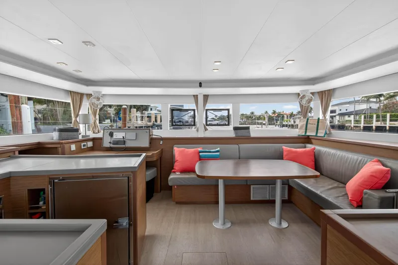 Slide: The Image of Interior of 2019 Lagoon 450 F yacht with modern seating and large windows. - 57