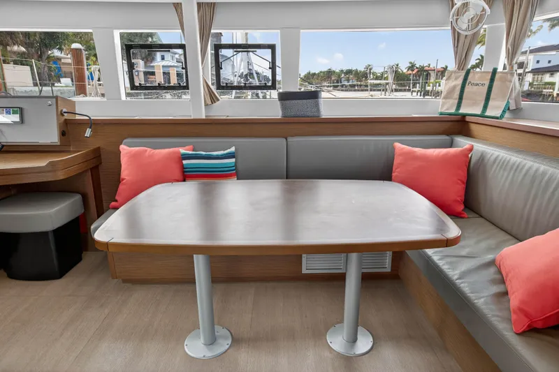 Slide: The Image of Interior of 2019 Lagoon 450 F catamaran with cozy seating and colorful cushions. - 60