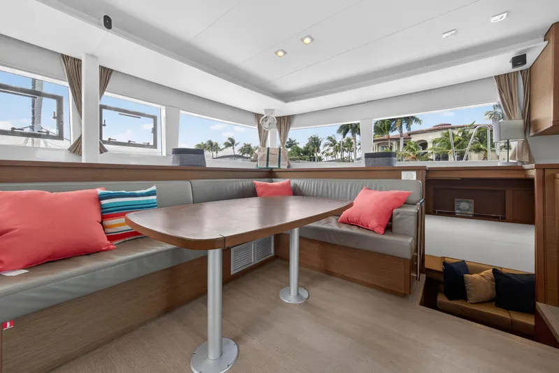 Slide: The Image of Interior of 2019 Lagoon 450 F yacht with modern seating and colorful cushions. - 63