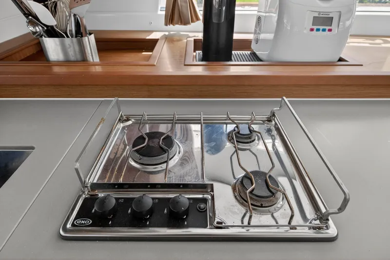 Slide: The Image of Modern kitchen stove on Lagoon 450 F yacht, 2019 model, with utensils and appliances. - 68