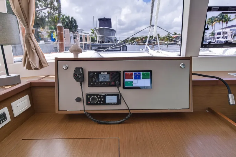 Slide: The Image of Interior view of 2019 Lagoon 450 F yacht's navigation panel with electronic controls. - 71