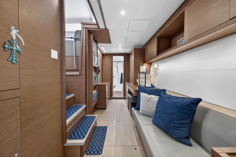 Slide: The Image of Luxurious interior of 2019 Lagoon 450 F yacht with modern wood finish and blue accents. - 73
