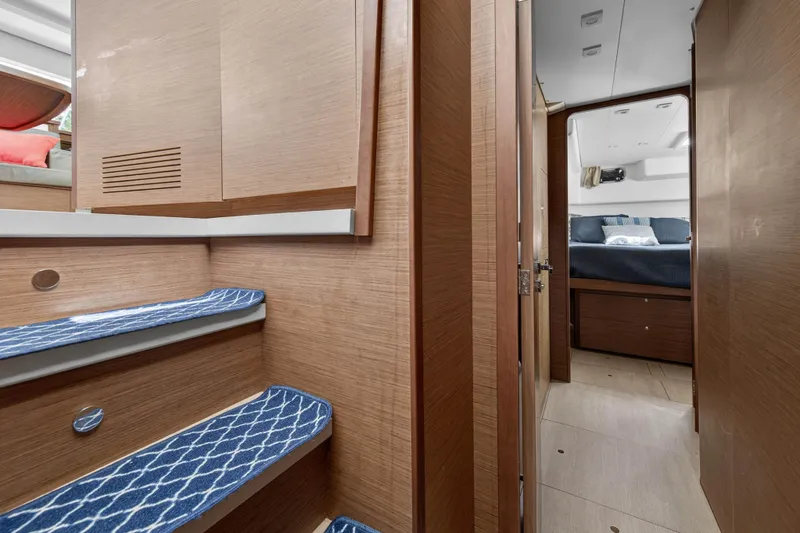 Slide: The Image of Interior of 2019 Lagoon 450 F yacht, featuring wooden stairs and cozy cabin. - 74