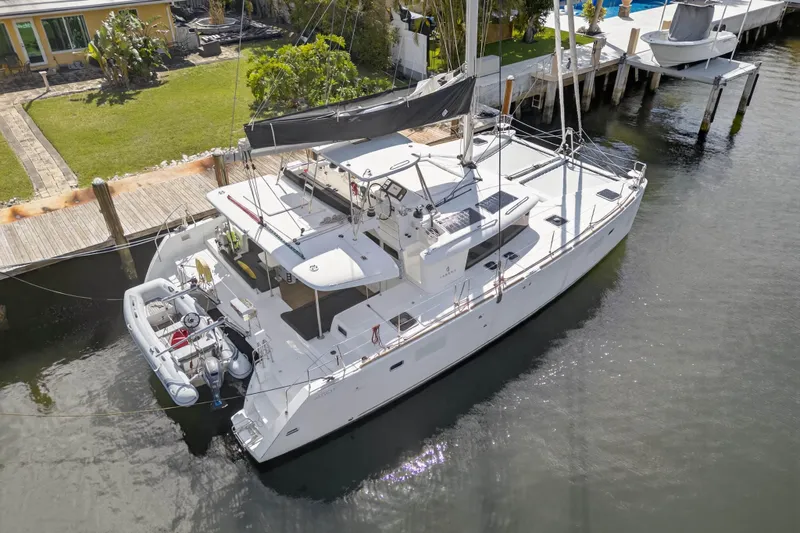 Slide: The Image of 2019 Lagoon 450 F catamaran docked at a marina, aerial view. - 8