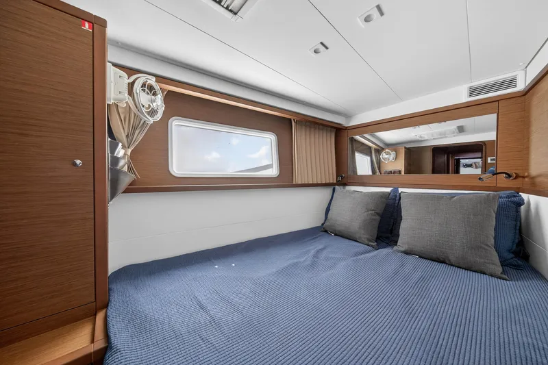 Slide: The Image of Luxurious cabin interior of 2019 Lagoon 450 F catamaran with cozy bedding and modern design. - 83