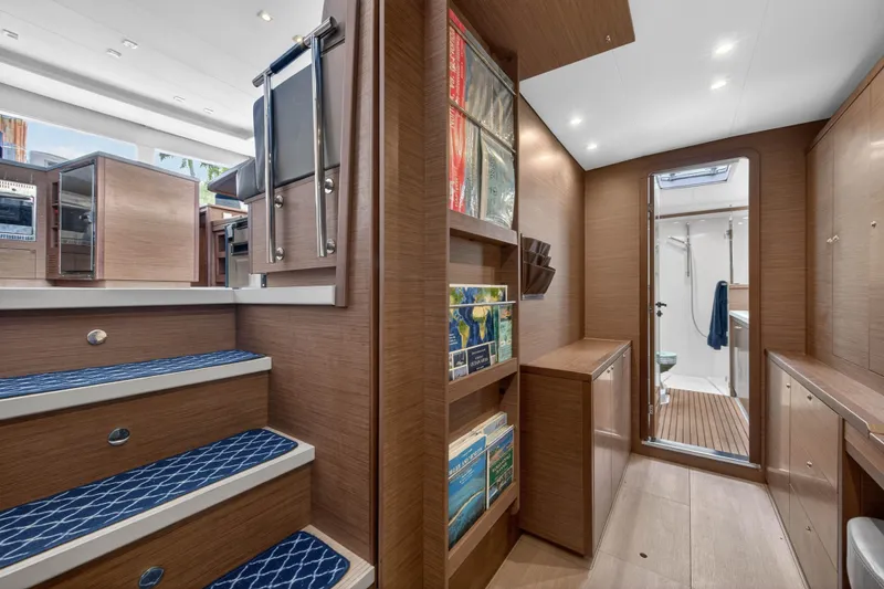 Slide: The Image of Interior of 2019 Lagoon 450 F yacht with wooden cabinetry and modern design. - 84