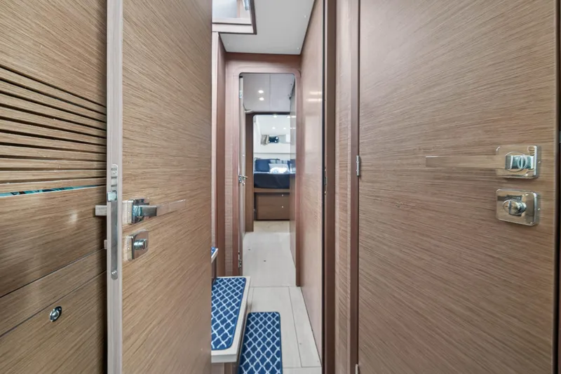 Slide: The Image of Interior hallway of 2019 Lagoon 450 F catamaran with wooden doors and modern design. - 86