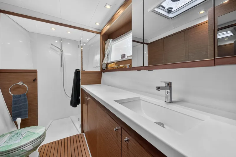 Slide: The Image of Modern bathroom in 2019 Lagoon 450 F yacht with sleek fixtures and wooden accents. - 88