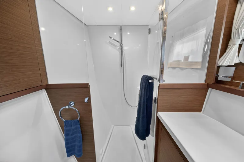 Slide: The Image of Modern bathroom interior of 2019 Lagoon 450 F yacht with sleek wood accents. - 90