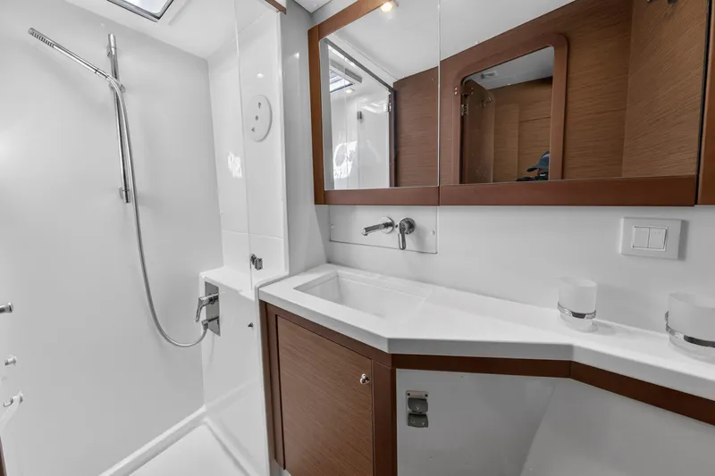 Slide: The Image of Modern bathroom in 2019 Lagoon 450 F yacht with sleek fixtures and wooden accents. - 91