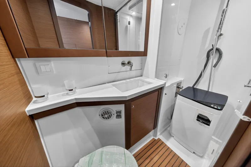 Slide: The Image of Modern bathroom in 2019 Lagoon 450 F yacht with sink, mirror, and washing machine. - 92