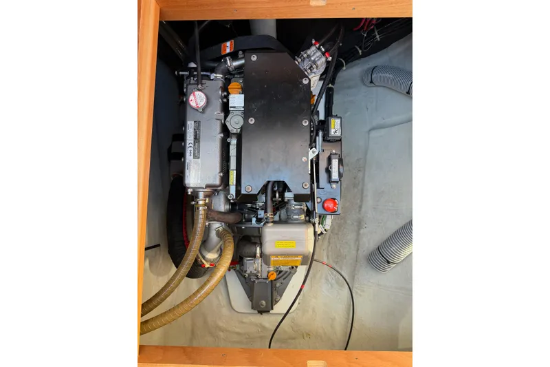 Slide: The Image of Engine compartment of a 2019 Lagoon 450 F catamaran, showcasing mechanical components. - 94