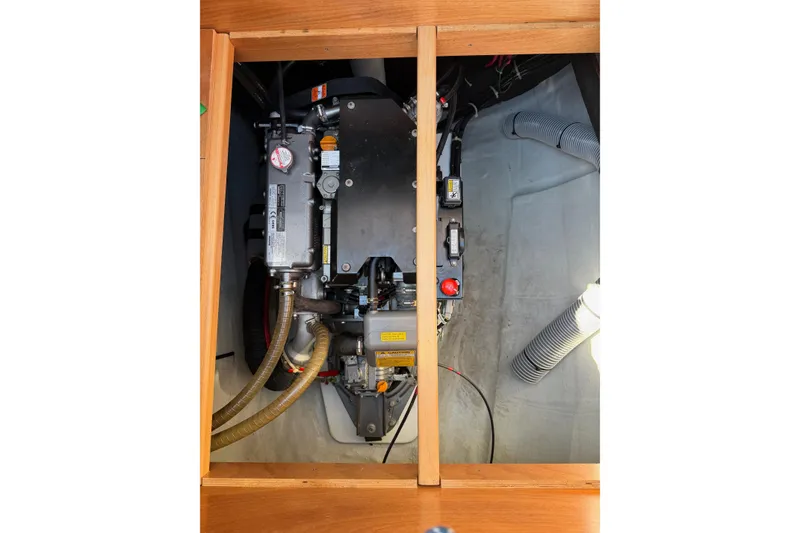 Slide: The Image of Engine compartment of a 2019 Lagoon 450 F catamaran, showcasing mechanical components. - 95