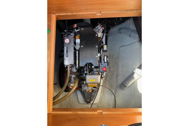 Slide: The Image of Engine compartment of a 2019 Lagoon 450 F catamaran, showcasing mechanical components. - 96