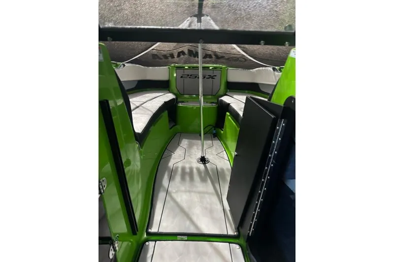 Slide: The Image of 2022 Yamaha Boats 255XD interior with green accents and seating area. - 3
