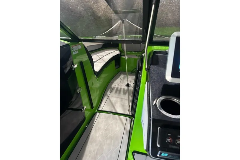Slide: The Image of Interior view of 2022 Yamaha Boats 255XD, featuring sleek green design and modern amenities. - 4
