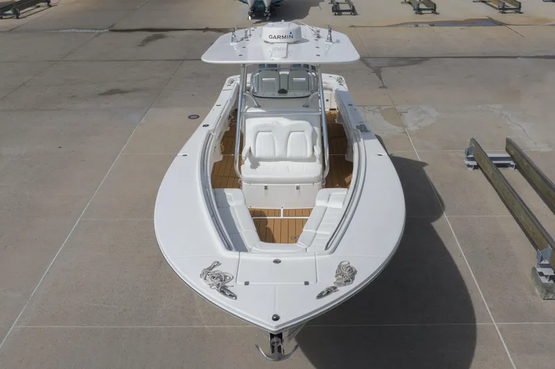 Slide: The Image of 2018 Regulator 31 boat with white deck and seating, viewed from above. - 10