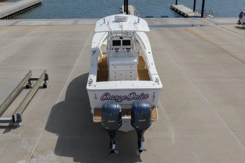Slide: The Image of 2018 Regulator 31 boat with twin 300 engines docked near water. - 22