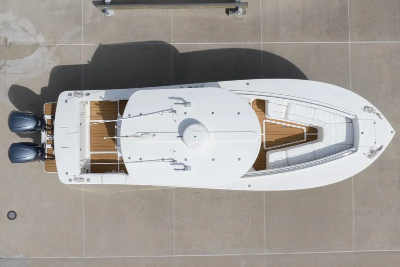 Slide: The Image of Overhead view of 2018 Regulator 31 boat with dual engines and spacious deck. - 3