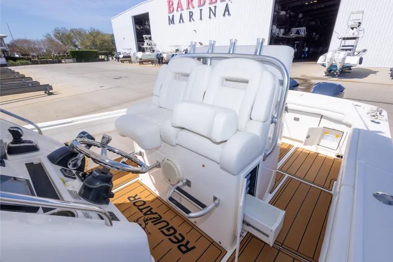 Slide: The Image of 2018 Regulator 31 boat interior with white seating at Barber Marina. - 46